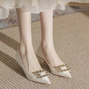 Elegant Cream Heels with Embellished Buckle